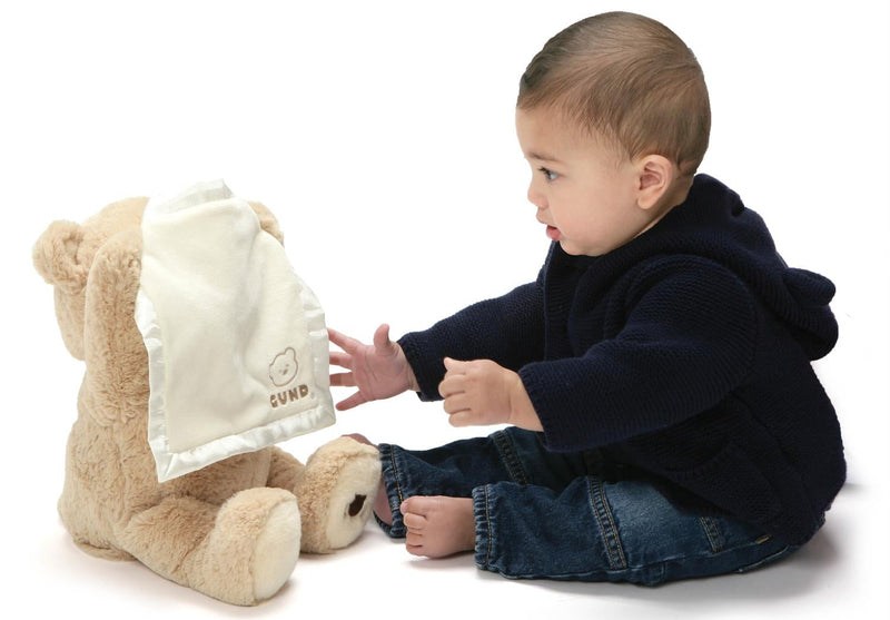 Baby playing peek-a-boo with GUND animated Peek-A-Boo Bear plush
