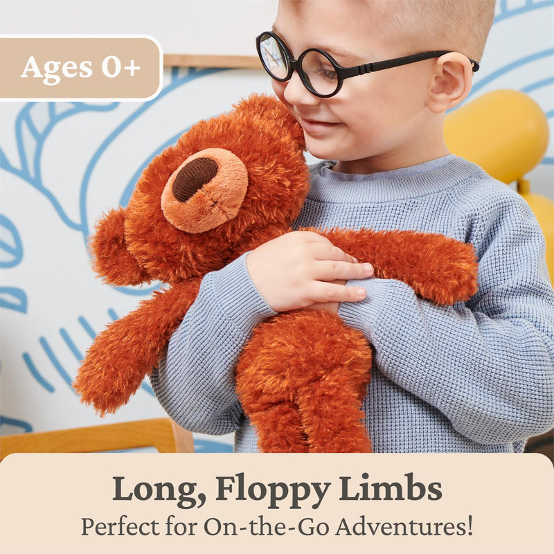 Child hugging GUND Pumpkin Pie Toothpick Bear plush