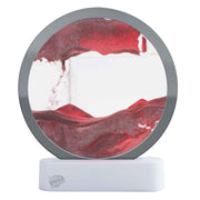 Circular sand art frame with red sand and white base showing flowing sand patterns