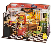 Toy garage set with various tools and equipment on a white background
