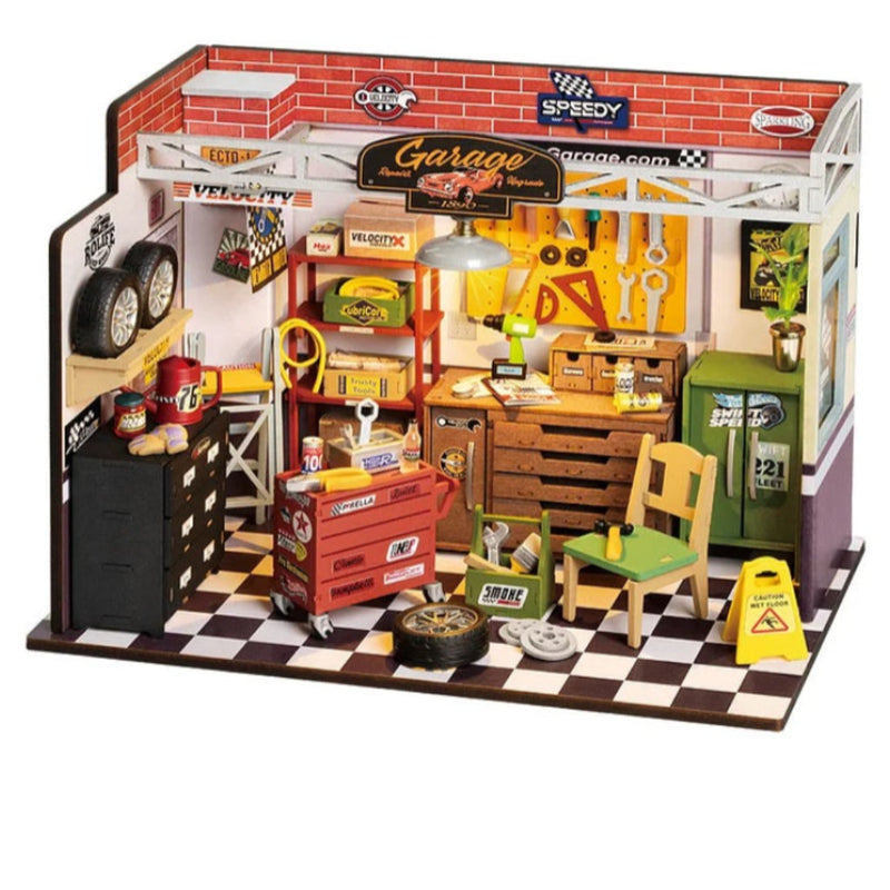 Toy garage set with various tools and equipment on a white background