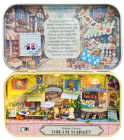 DIY Miniatures Dream Market tin box diorama open showing illuminated market scene.