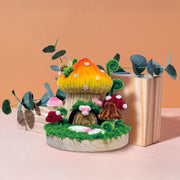 Colorful chenille mushroom house craft kit with decorative eucalyptus styling