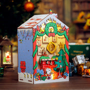 Peanuts Christmas House cardboard model displayed on wooden surface with Christmas tree background