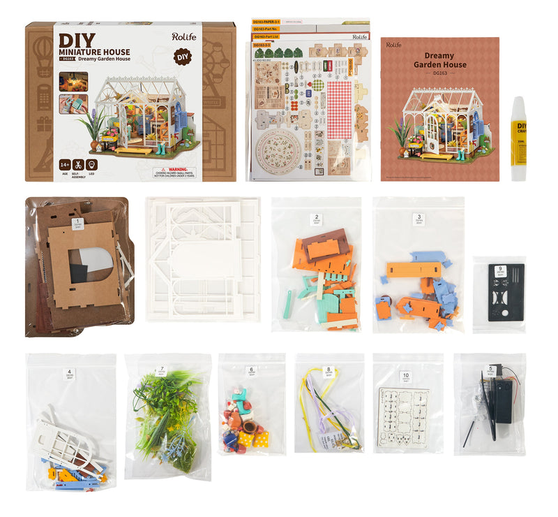 DIY miniature dollhouse kit with packaging, parts, and assembly components displayed
