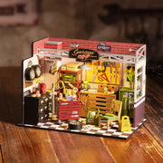 Miniature garage workshop dollhouse kit with tools, workbench, and automotive accessories