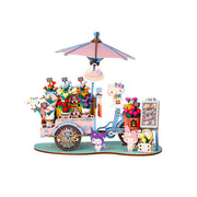 Colorful miniature flower cart model with umbrella, flowers, and cute character figures