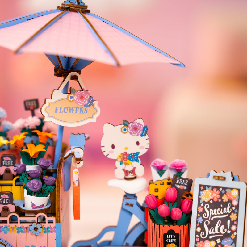 Assembled flower cart miniature with Hello Kitty figure, umbrella, and colorful flower displays