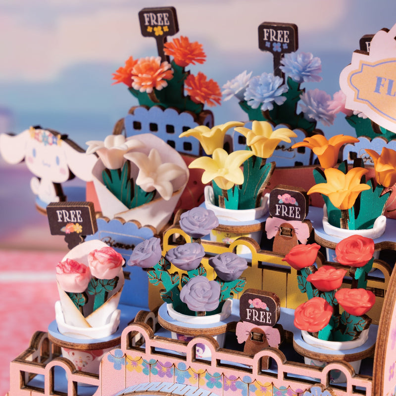 Colorful DIY flower cart model with various miniature flowers and FREE signs