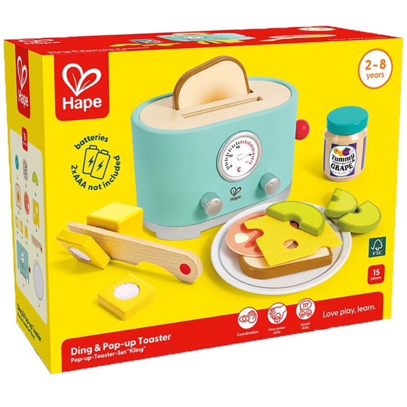 Hape Ding & Pop-up Toaster Pop-up Toaster Set 'Kling' toy set in its original yellow packaging box, featuring a light blue wooden toaster, yellow butter, green apple slices, and wooden bread pieces.