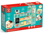 Hape Smart & Wooden Supermarket toy set in its original retail packaging, featuring a colorful illustration of the wooden play supermarket on a teal and red box.