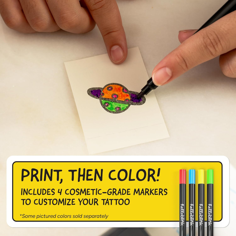 Coloring a small tattoo design with markers on a piece of paper, including text about the product.