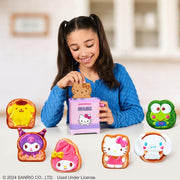 Girl playing with Hello Kitty-themed cookie toys on a table.