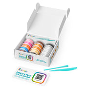 Box of colorful Hey Clay containers with tools on a white background.