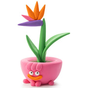 Pink planter with Bird of Paradise plant made out of Hey Clay from Fat Brain Toys on a white background. 