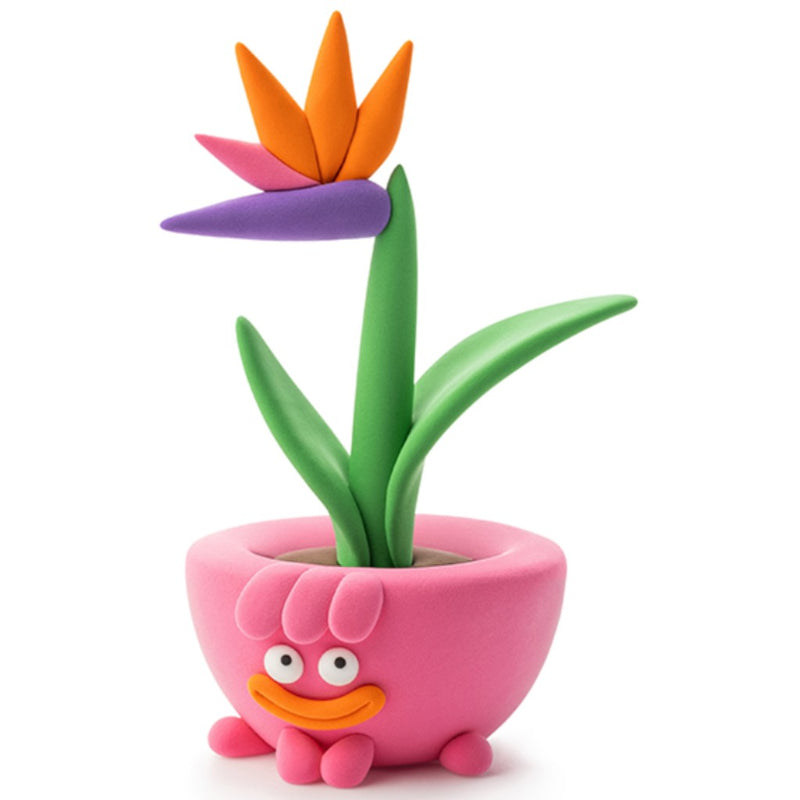 Pink planter with Bird of Paradise plant made out of Hey Clay from Fat Brain Toys on a white background. 