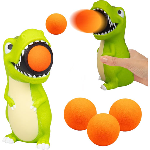 Green dinosaur toy with orange balls on a white background