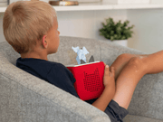 Child using Tonie Horton Hears a Who audio player on couch