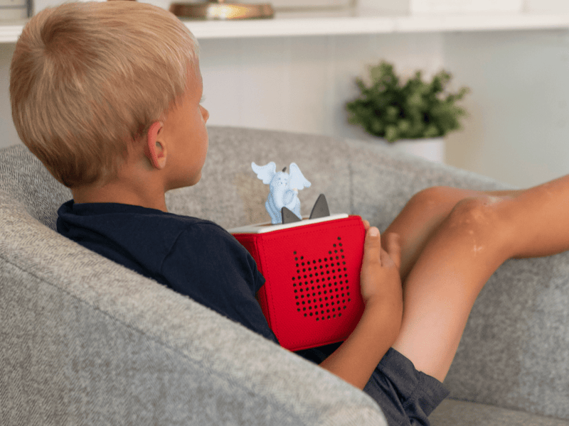 Child using Tonie Horton Hears a Who audio player on couch