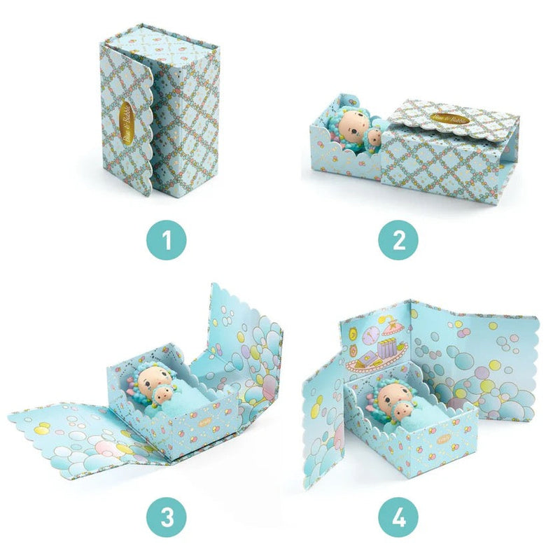 DJECO Tinyly Blue Tinyroom box opens to reveal miniature baby doll in decorative crib, four-step display