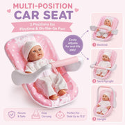 Pink and white polka dot baby car seat with a doll, shown on a light pink background with text and three inset diagrams demonstrating reclined, semi-upright, and upright positions.