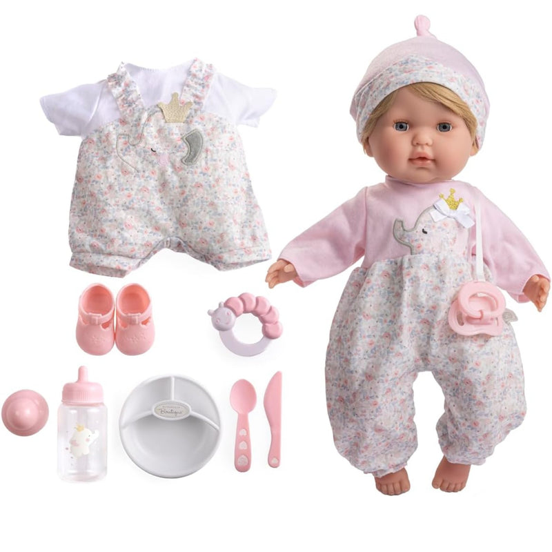 Baby doll and outfit set with a pink and white floral romper, matching hat, pacifier clip, white bib, pink shoes, pacifier, bottle, bowl, spoon, and knife, shown on a white background.