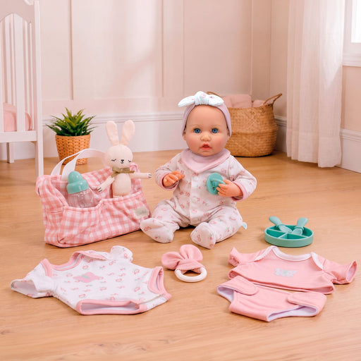 JC Toys Bonbebé weighted baby doll with pink diaper bag, clothing and feeding accessories.