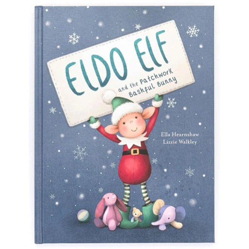 Children's book cover for 'Eldo Elf and the Patchwork Bashful Bunny' featuring a whimsical elf character holding a sign, surrounded by plush toys on a snowy blue background.