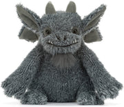A gray plush dragon toy with large pointed ears, small horns, and a stitched smile, photographed against a plain white background.