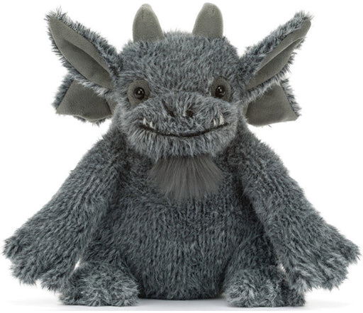 A gray plush dragon toy with large pointed ears, small horns, and a stitched smile, photographed against a plain white background.
