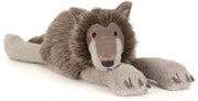 Ulrich Wolf from Jellycat is looking relaxed laying on his belly.  He's got black eyes and a bit of a mane around his face and is pictured on a white background.