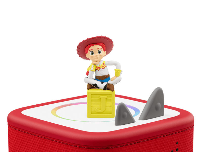 Tonie Disney Toy Story 3 Jessie figure sitting on yellow block on red Toniebox speaker