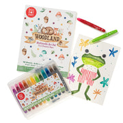 Do A Dot Art Woodland Art Pad with watercolor crayons and markers shown with child's drawing
