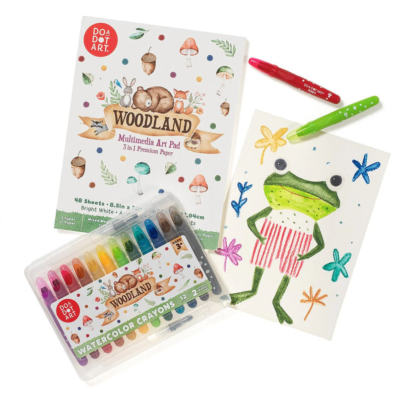 Do A Dot Art Woodland Art Pad with watercolor crayons and markers shown with child's drawing