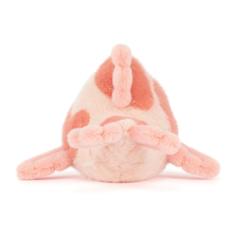 Pink plush carp fish stuffed animal with soft coral spots on white background