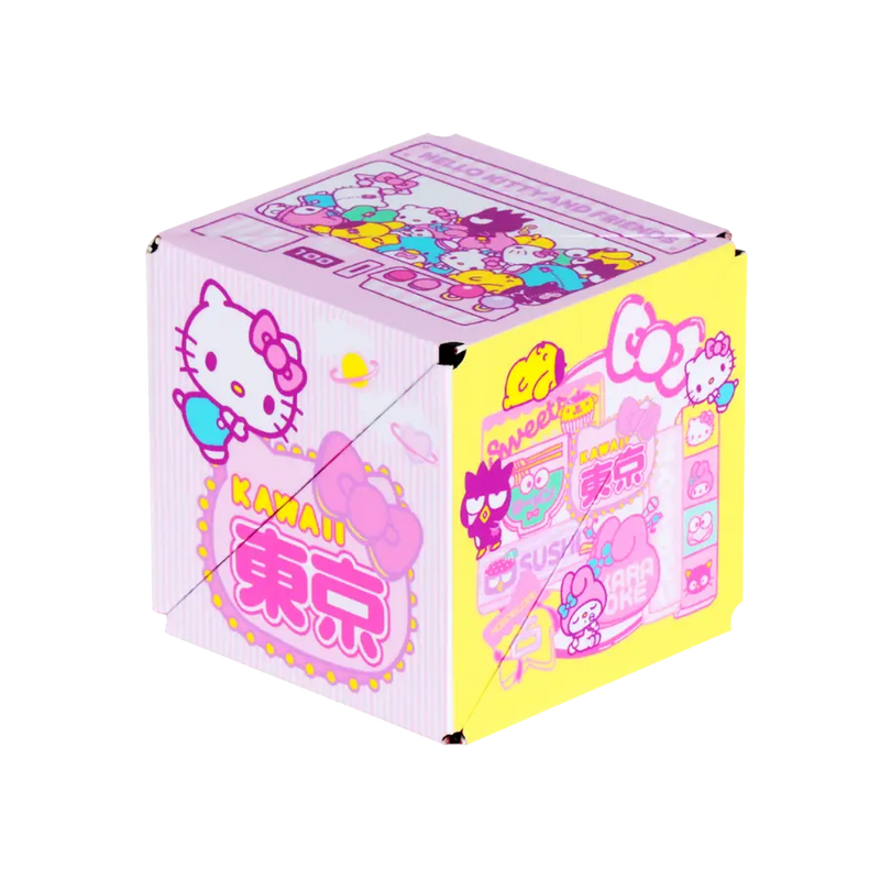 Pink Shashibo Hello Kitty magnetic puzzle cube showing multiple character-decorated sides