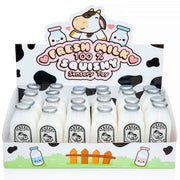 A retail display box filled with small squishy milk bottles labeled 'Fresh Milk 100% Squishy Sensory Toy' on a white background.