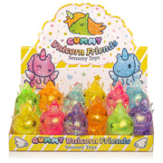 Display of colorful unicorn-themed sensory toys with packaging featuring cartoon unicorns.