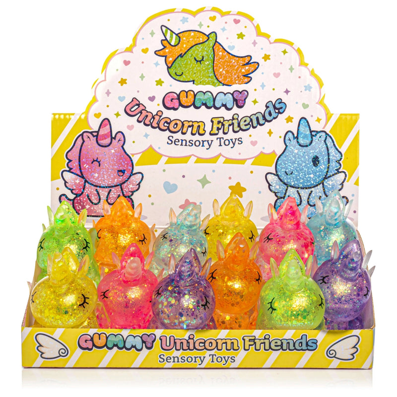 Display of colorful unicorn-themed sensory toys with packaging featuring cartoon unicorns.