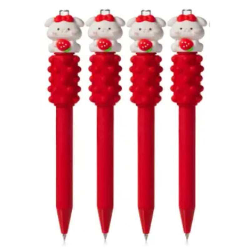 Four red retractable pens with white cartoon bummy caps holding red strawberries and a spinning fidget directly under them, shown against a plain white background.