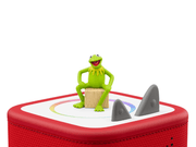 Kermit the Frog Tonie figure sitting on red Toniebox with shark fins