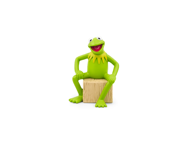 Kermit the Frog Tonie figure sitting on wooden block against green background