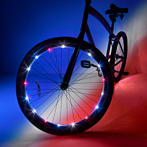 Bicycle wheel with patriotic red white and blue LED lights on spokes