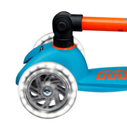 Blue scooter with orange handlebar with lighted LED wheels on a white background