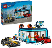 A LEGO City building set showing a blue and teal ice wash station with a red car inside, a gray and yellow car outside, and two minifigures on a plain white background.