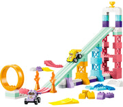LEGO Duplo 12042 Niki Racing Car Builder set.  A colorful set featuring a ramp, tower, loop, ramps, flame pieces, and small toy cars on a plain white background.