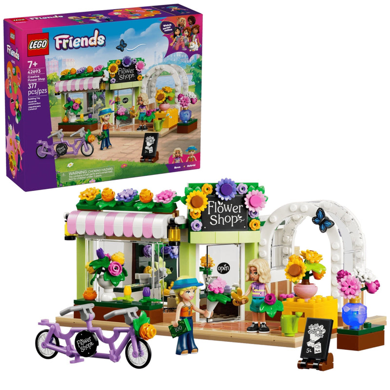 LEGO Friends Flower Shop building set shown with the retail box and assembled model on a white background. The set includes a flower shop storefront with colorful flowers, an arched entrance, a purple heart-shaped bicycle, and two minifigures.