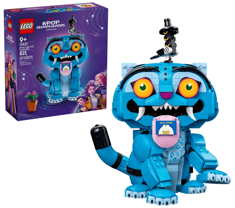 LEGO K-POP Dragon Warrior set 42422 building toy shown with its retail box on a white background. The assembled toy is a blue dragon character with large orange eyes, white fangs, a pink belly screen, and a small black-and-white bird figure on top.