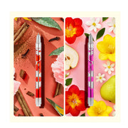 Two decorative pens with floral and spice themed styling on colorful backgrounds