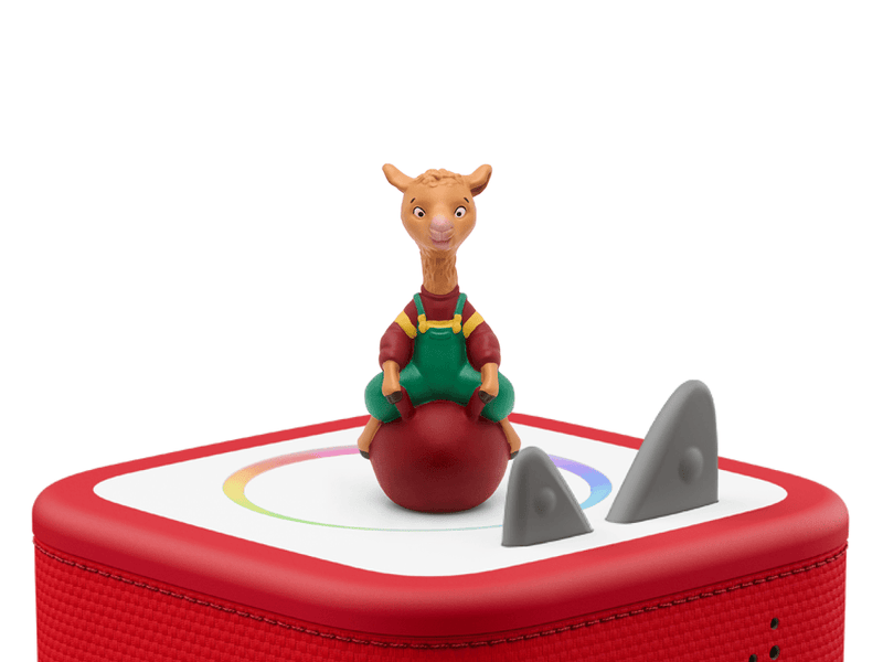 Llama Llama Tonie figurine sitting on red ball on Toniebox with shark fins